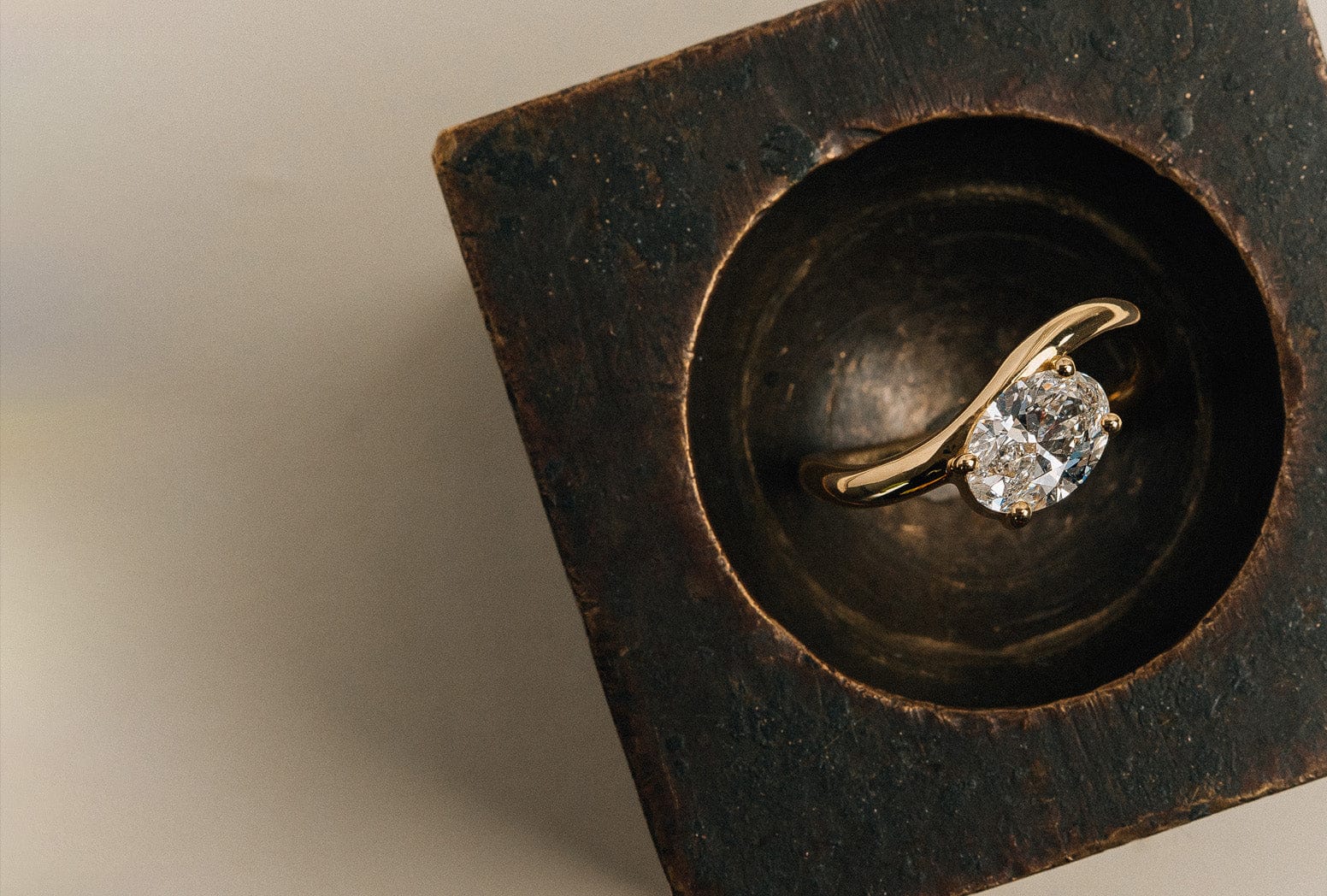 Yellow gold oval cut natural white diamond solitaire ring.