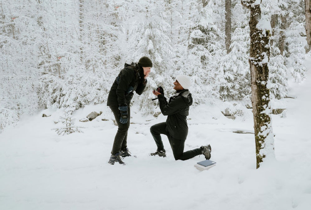 Couple proposal in snow scenery