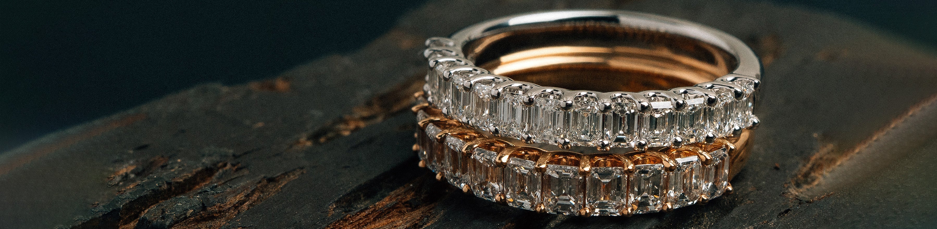 Rose and white gold bands with natural emerald cut white diamonds.