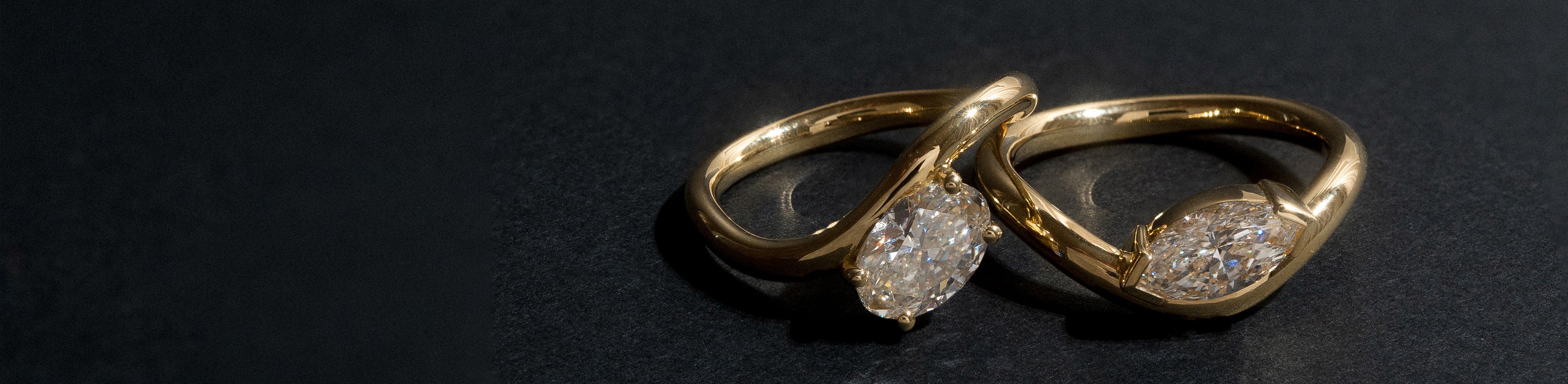 Yellow gold solitaire rings with oval and marquise cut natural white diamonds.