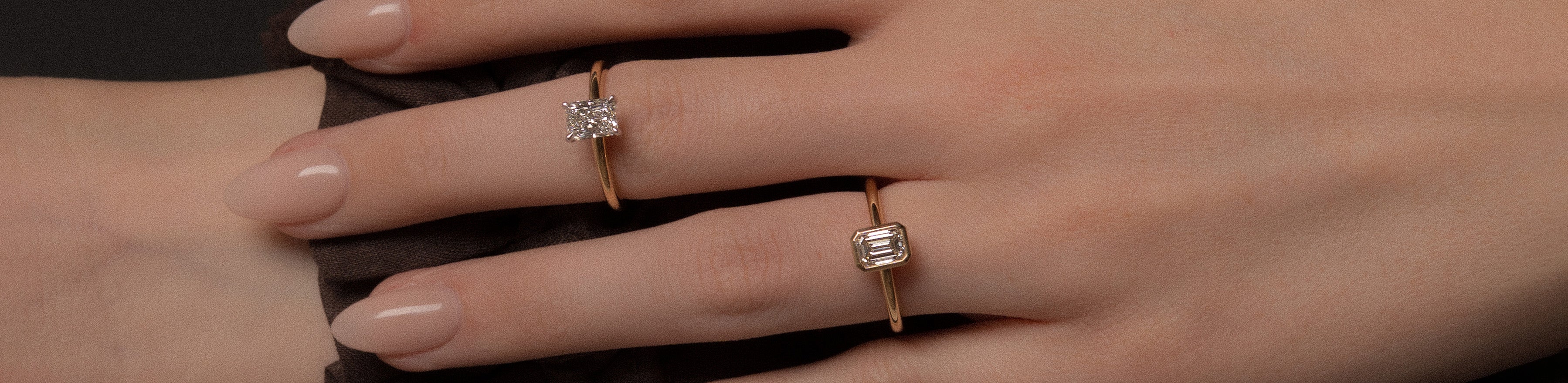 18k yellow and white gold emerald and radiant cut natural white diamond solitaire engagement rings modelled.