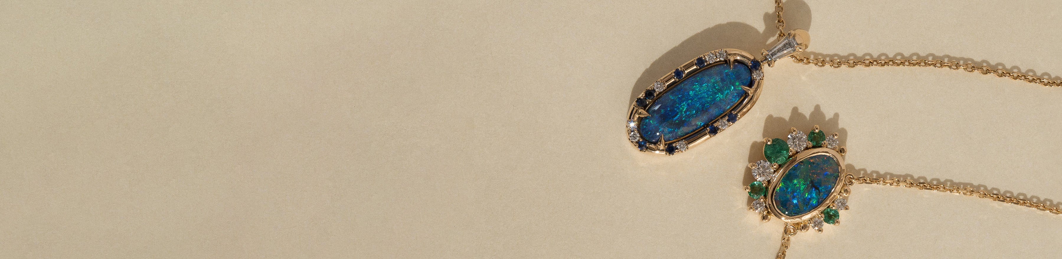 Yellow and white gold opal pendants with natural white diamonds, sapphires and emerald gemstones.