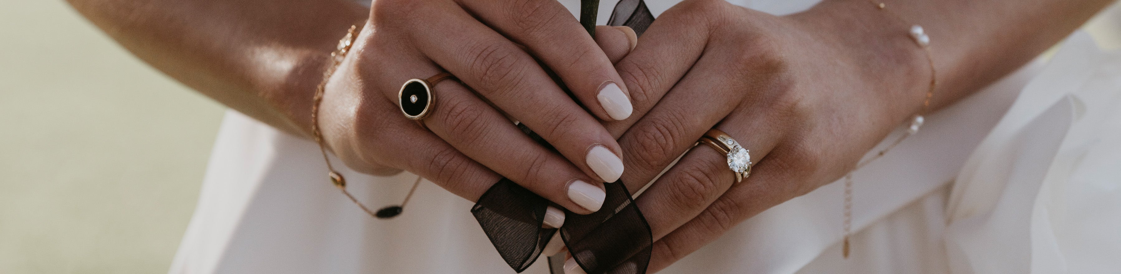 Bride wearing diamond wedding band and engagement ring set.