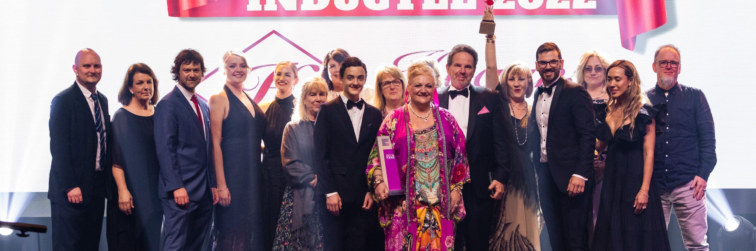 Hogans Family Jewellers staff members on stage accepting business award at Toowoomba Chamber's Business Excellence 2022 Awards.