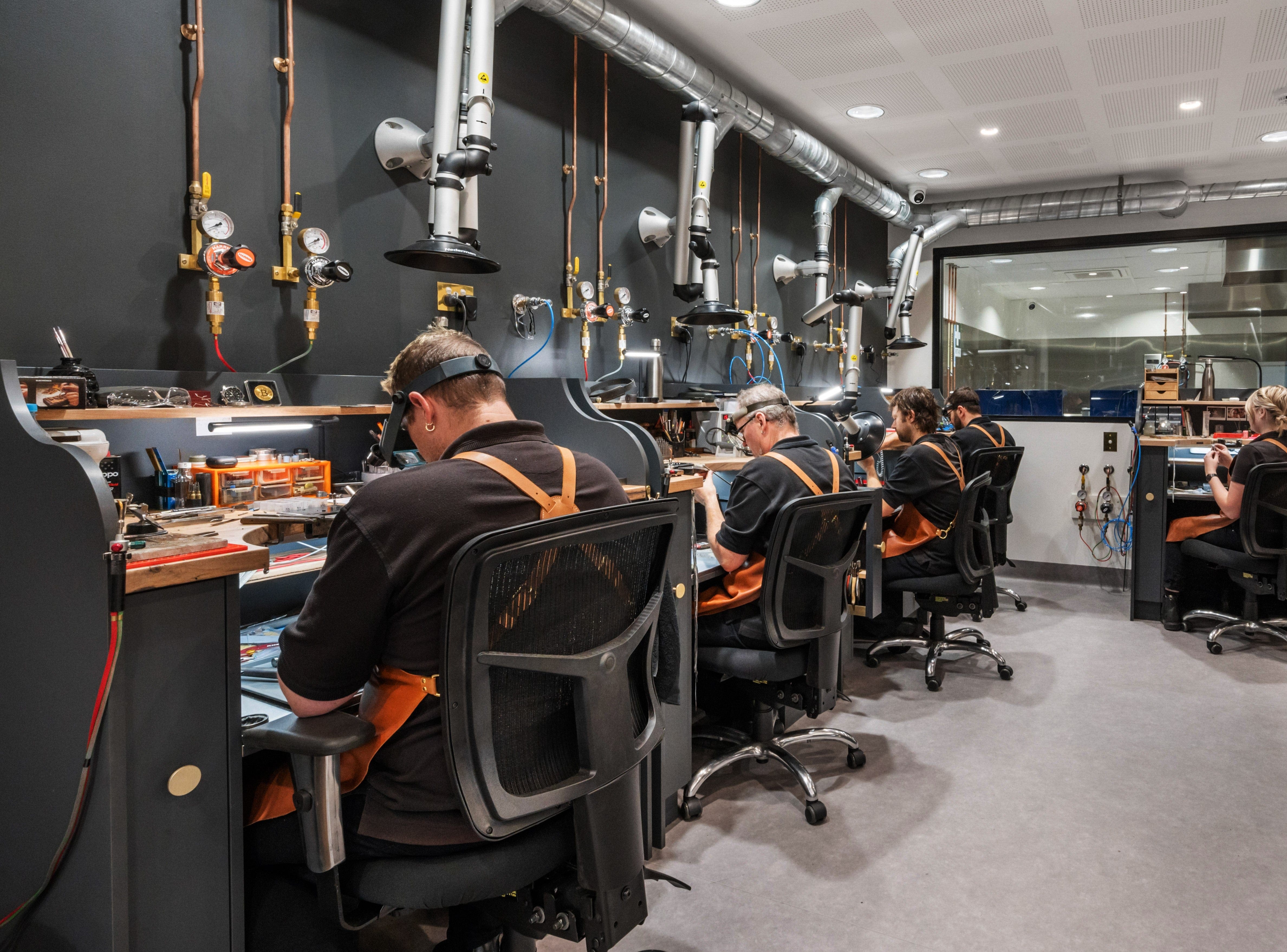 Jewellers working on benches at Hogans Family Jewellers, Toowoomba.
