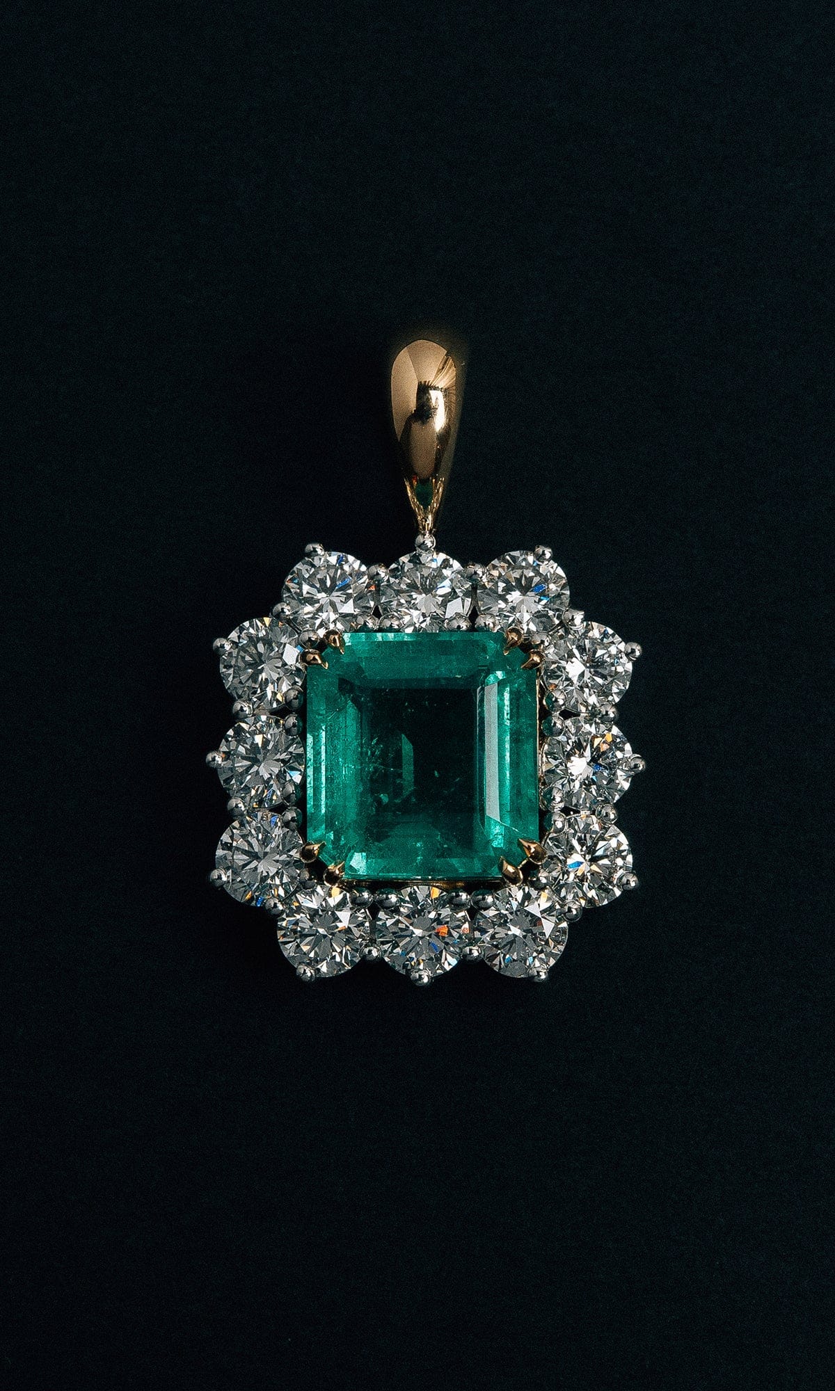 Hogans Family Jewellers 18K YWG Emerald Cut Emerald Halo Pendant