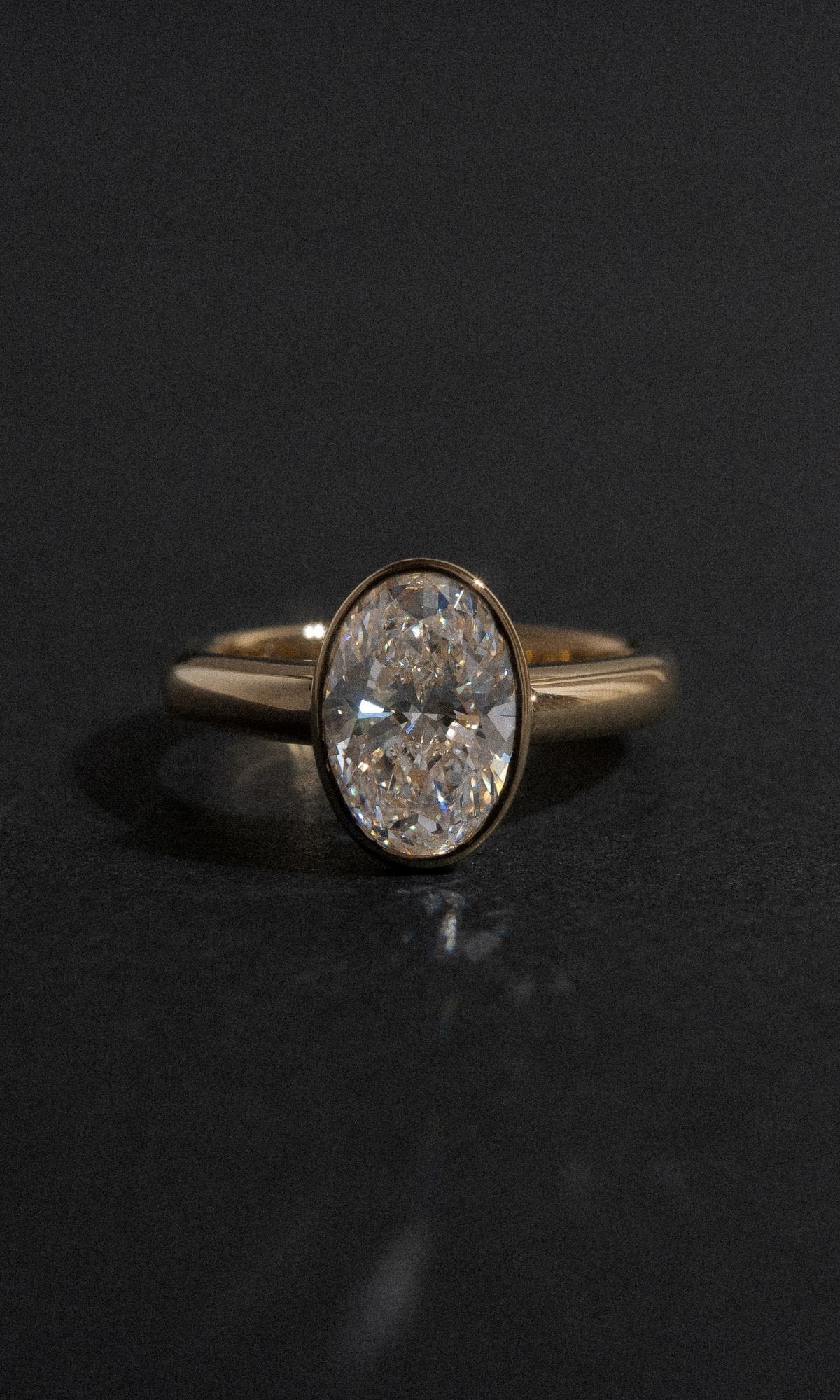 Hogans Family Jewellers Bespoke 18K YG Bezel Set Oval Diamond Ring