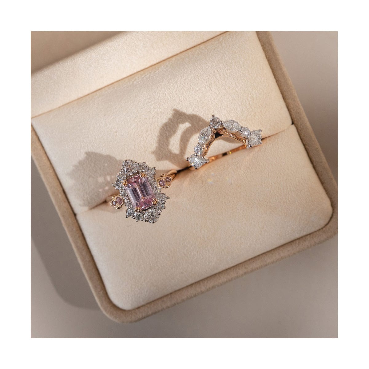 Custom made pink sapphire and diamond engagement ring and custom made fitted wedding band in beige ring box.