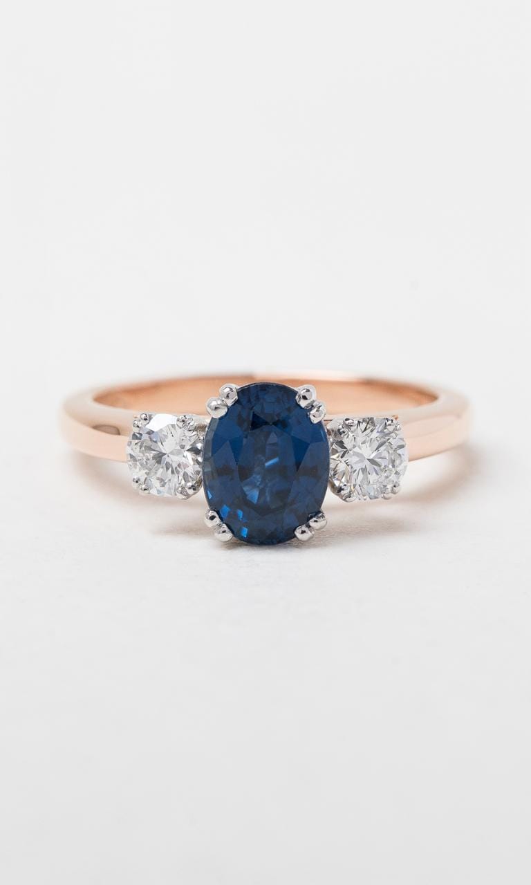 Hogans Family Jewellers 18K RWG Oval Cut Ceylon Sapphire Trilogy Ring