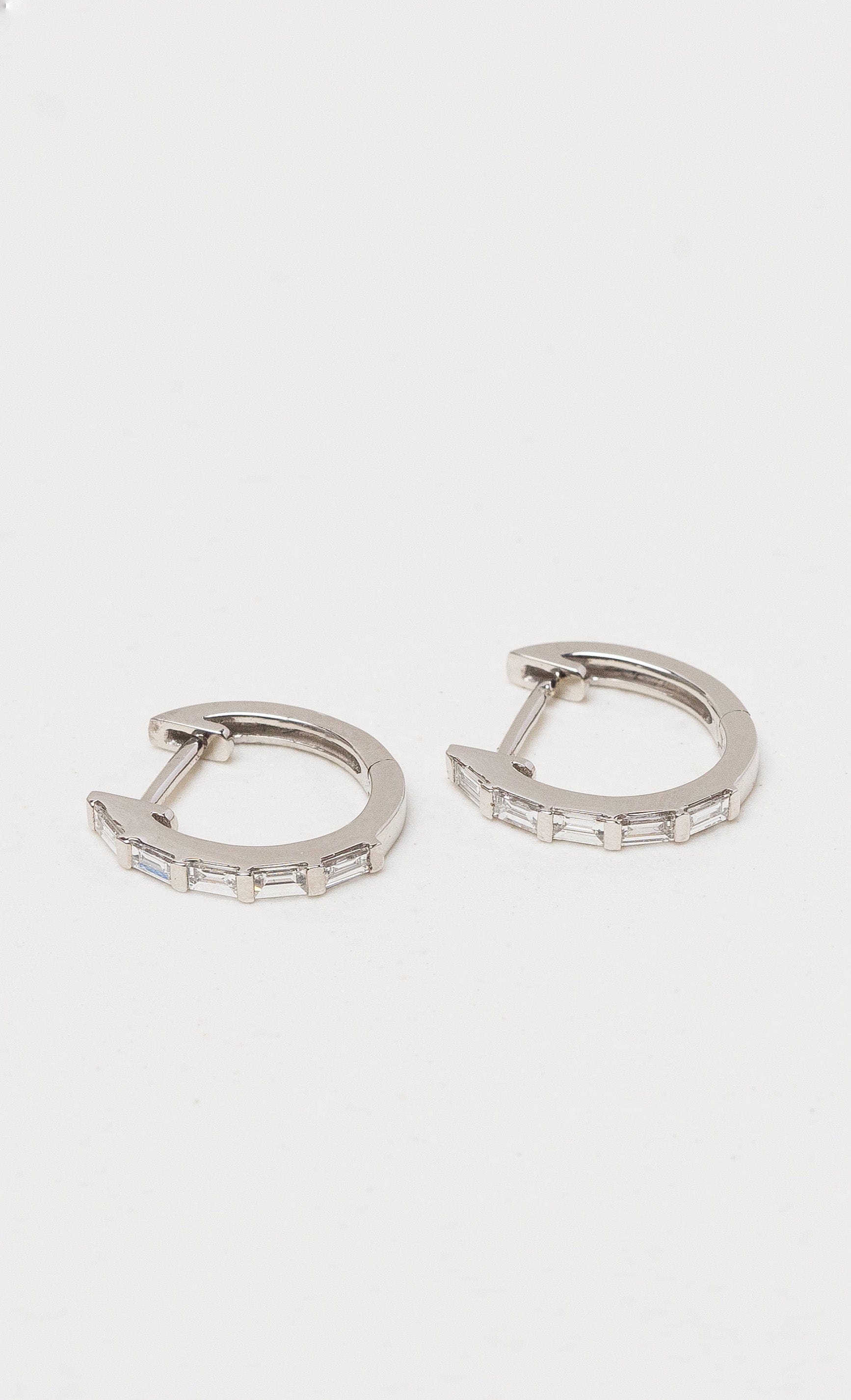 Hogans Family Jewellers 18K WG Baguette Diamond Huggie Earrings