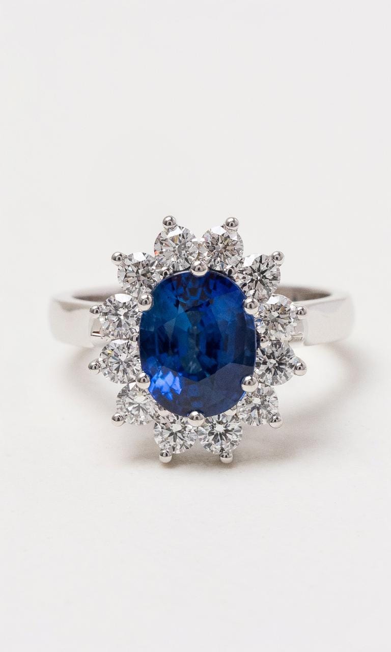Hogans Family Jewellers 18K WG Oval Cut Ceylon Sapphire Claw Set Halo Style Ring