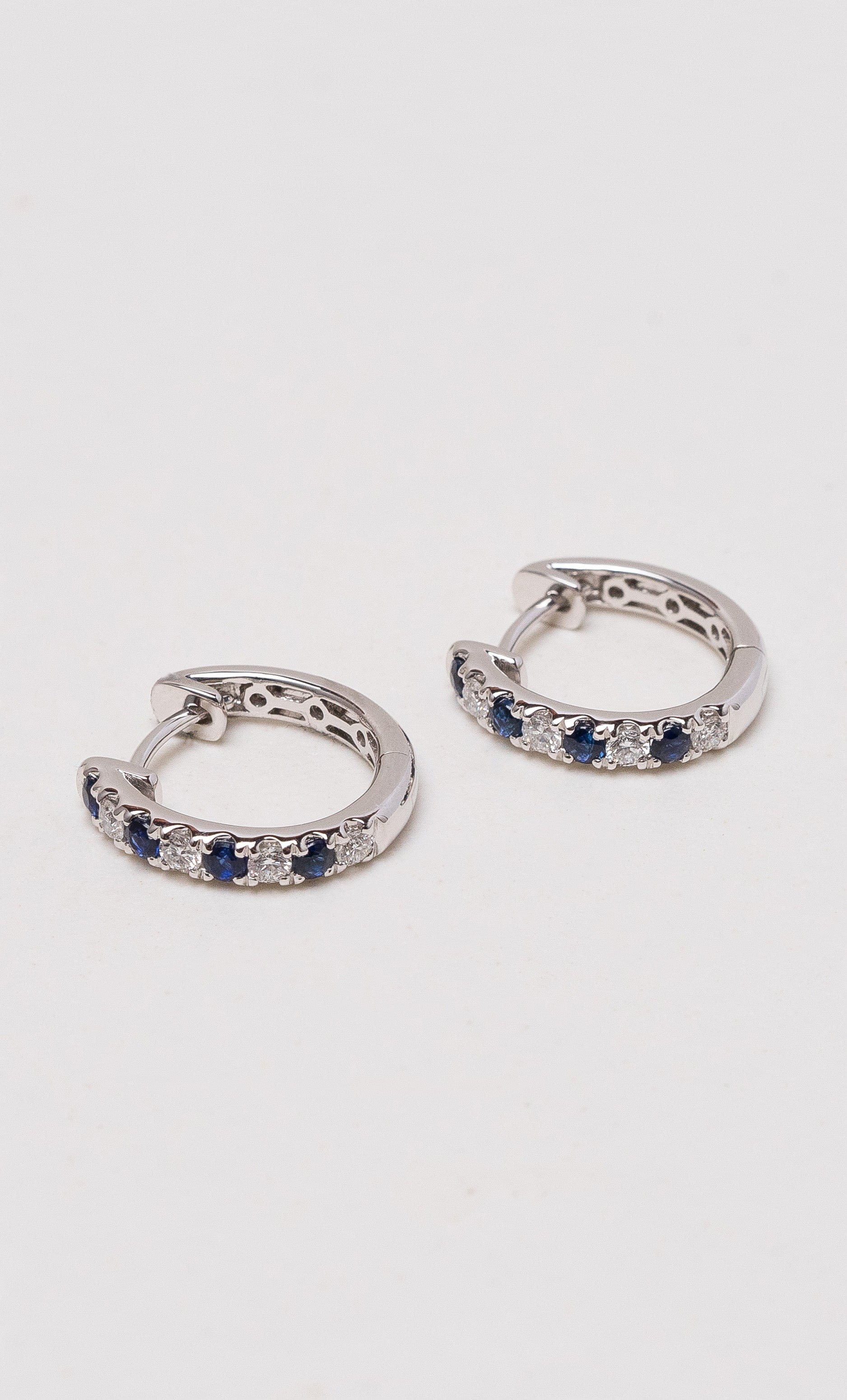 Hogans Family Jewellers 18K WG Sapphire & Diamond Huggie Earrings