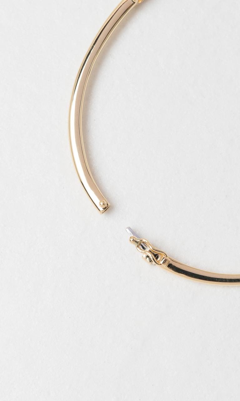 Hogans Family Jewellers 18K YG 0.25ct Oval Cut Diamond Hinged Bangle