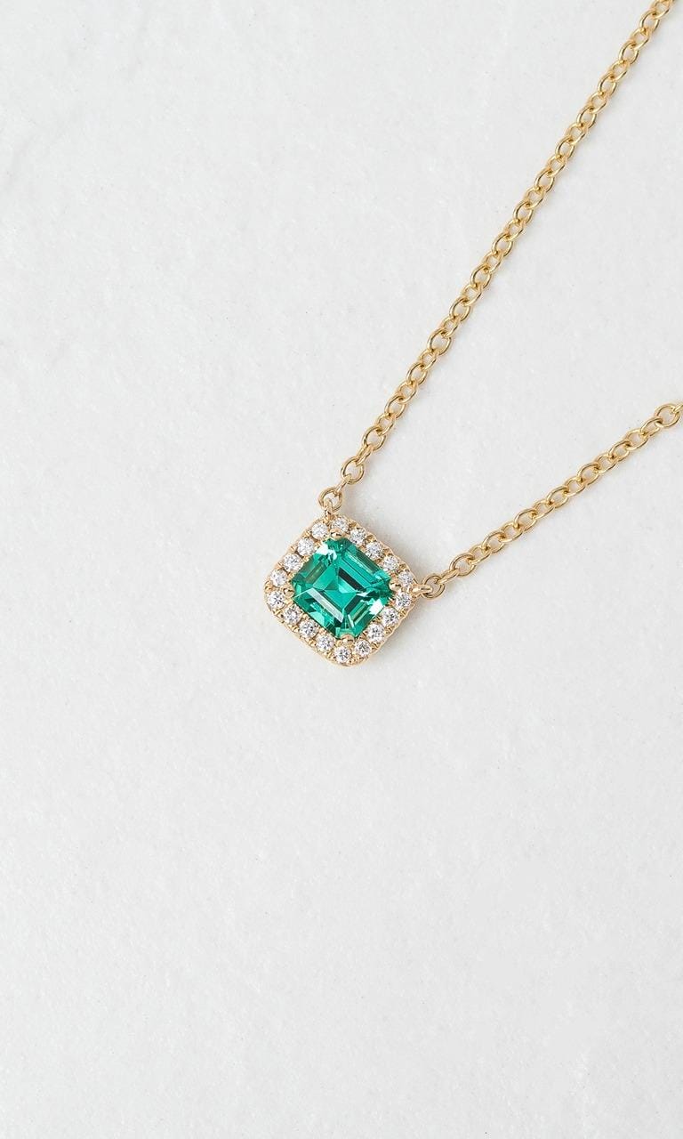 Hogans Family Jewellers 18K YG Emerald Cut Emerald Halo Necklace