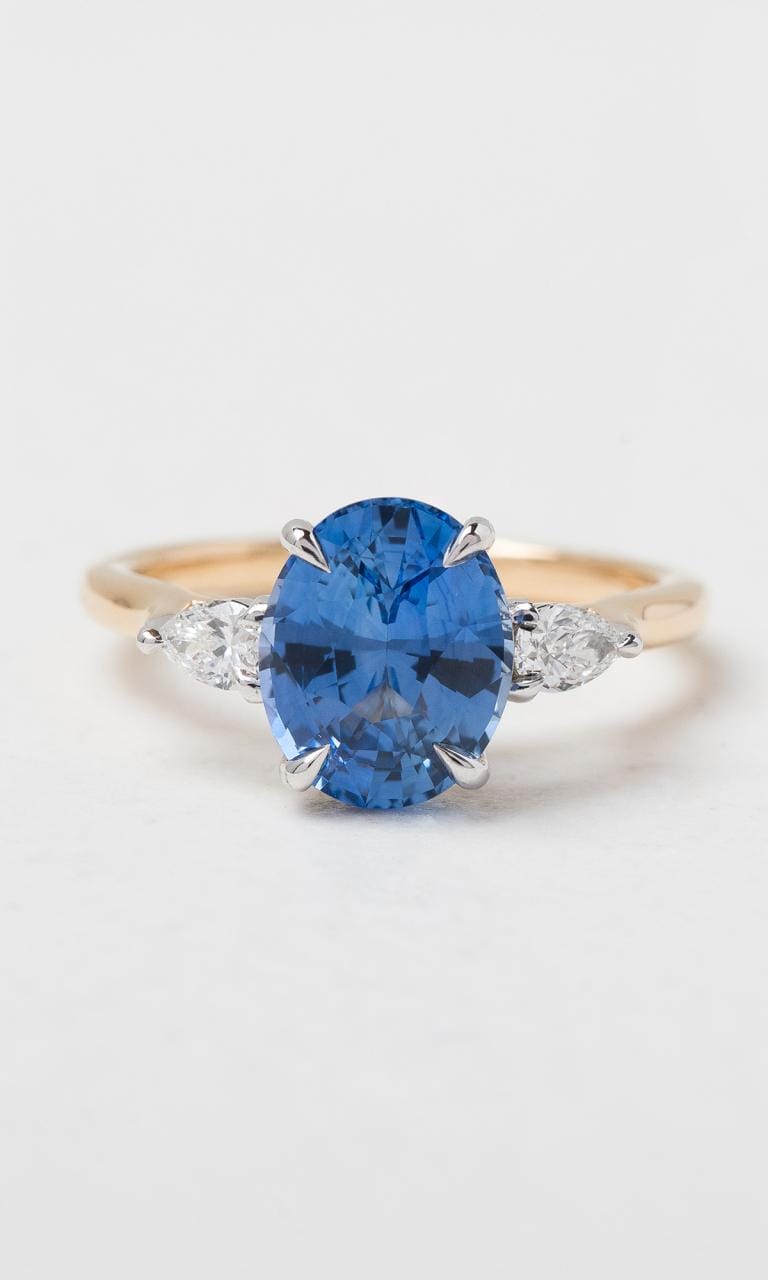 Hogans Family Jewellers 18K YWG Oval Cut Ceylon Sapphire Trilogy Ring