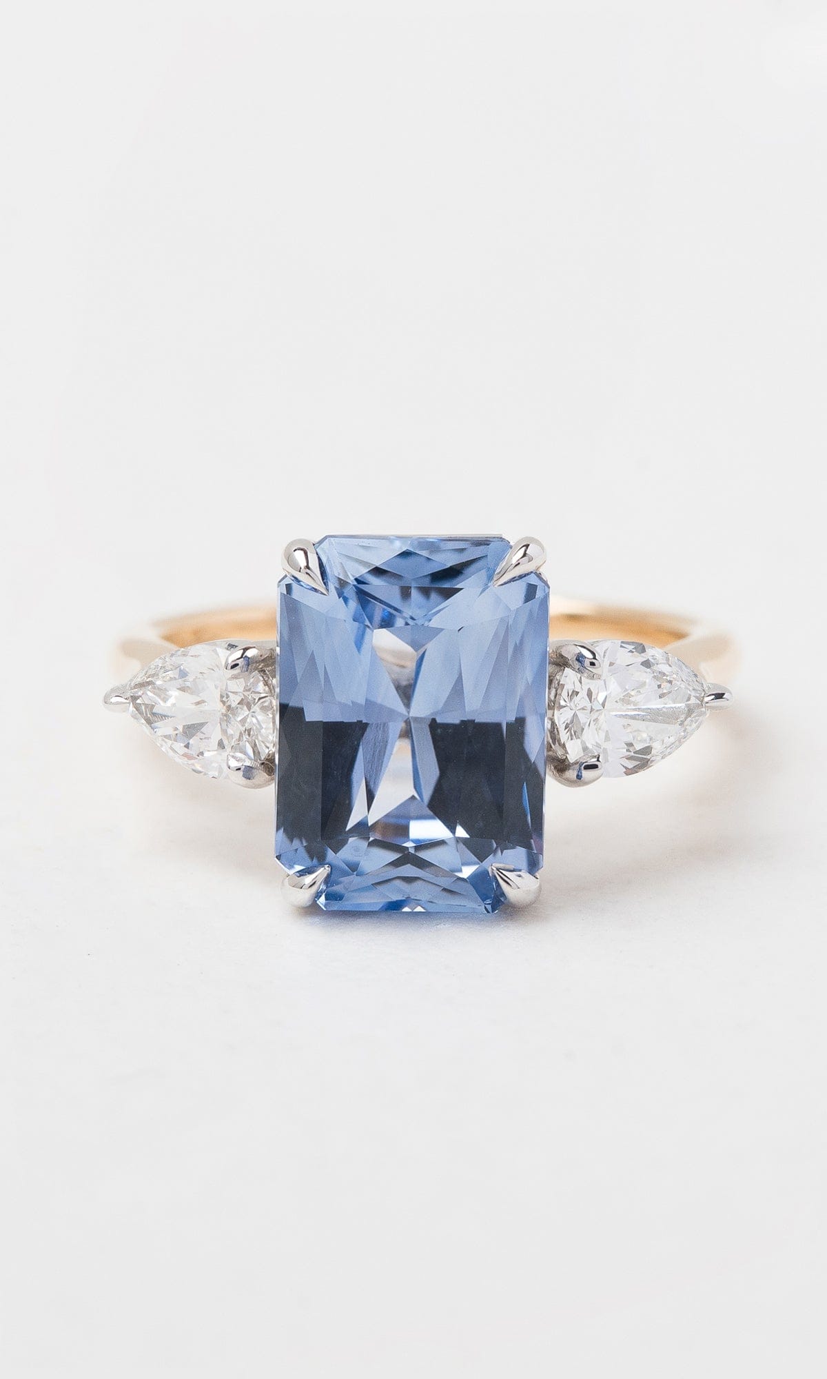 Hogans Family Jewellers 18K YWG Radiant Cut Blue Sapphire Trilogy Ring