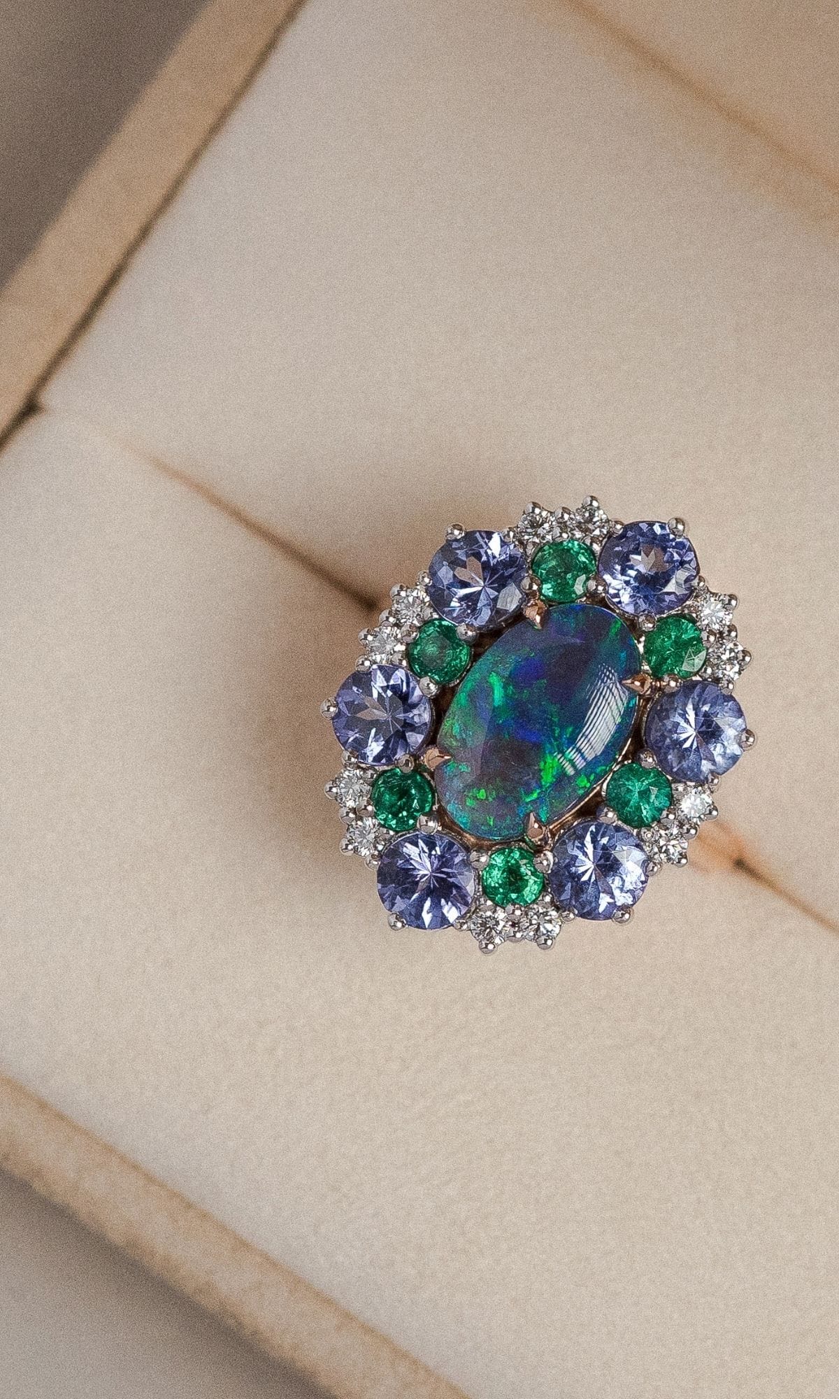 Hogans Family Jewellers Bespoke 18K RWG Opal, Emerald & Tanzanite Cluster Dress Ring