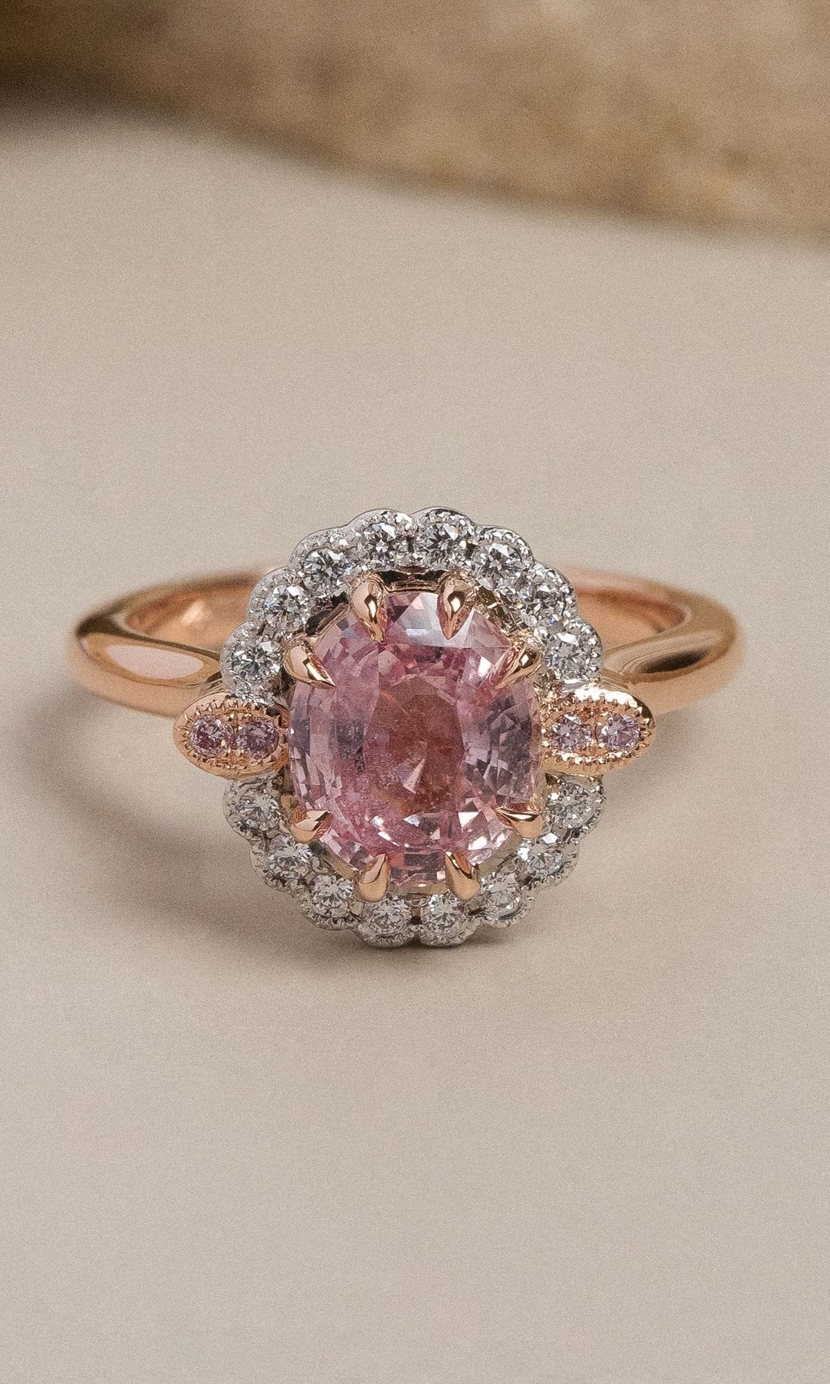 Hogans Family Jewellers Bespoke 18K RWG Padparadscha Sapphire & Australian Pink Diamond Halo Ring